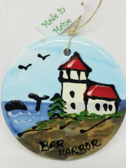 Lighthouse With Whale On Disc Ceramic Ornament