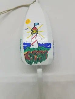 Red And White Striped Lighthouse On White Buoy Ornament